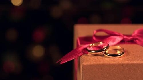 Wedding Rings on Gift Box with Ribbon