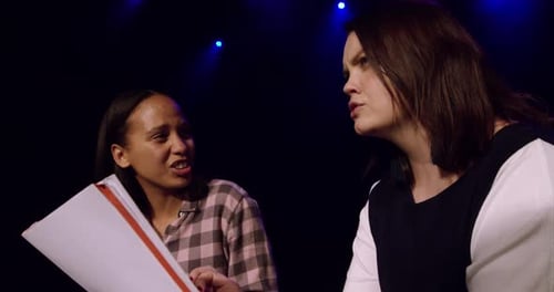 Teenagers rehearsing in a theatre