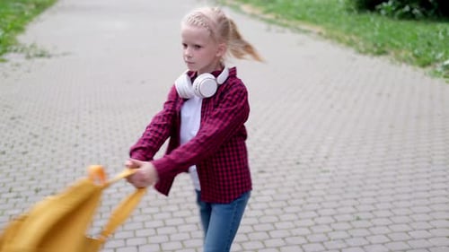 Back to School Children Playing on Street Blonde Boy and Girl Spinning with Backpacks