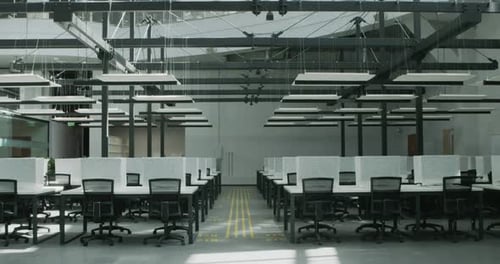 Modern Office Interior with Rows of Desks