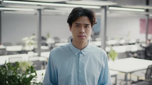 Confident Korean Business Guy Posing Standing In Office
