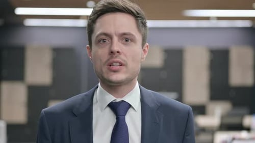 Businessman Speaking Directly to the Camera