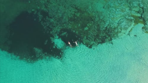 Transparent sea water near stony remote coast
