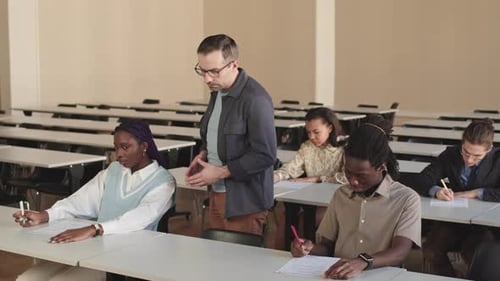 Students taking a test in a classroom setting