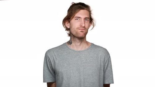 Young Adult Standing Against White Background