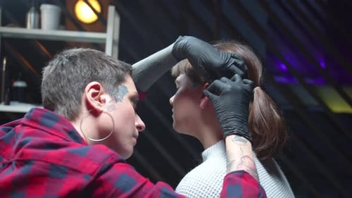 Ear Piercing Process in Tattoo Parlor