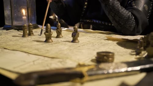 Person Planning Strategy with Map and Chess Pieces