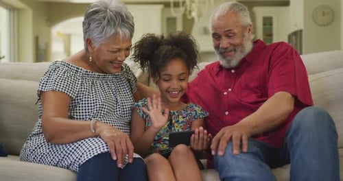 Child Video Calling With Grandparents At Home