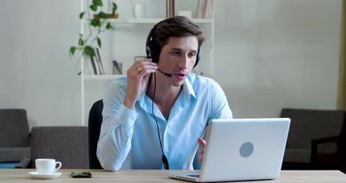 Serious Teacher with Boss Men Sits at Table at Home, Works Remotely From Room, Speaks Communicates