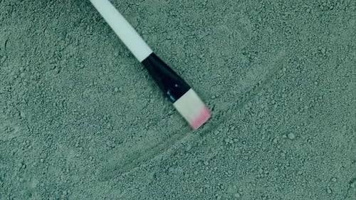 Makeup Brush Moving in Green Powder