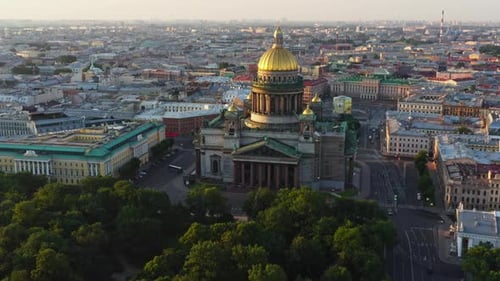 Aerial Morning Cityscape with Golden Dome of Isaac Cathedral at Sunrise Columns and Cross of Church