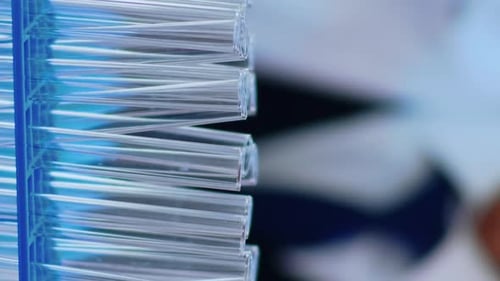 Vertical Video Close Up of Chemist Filling Test Tube with Liquid Using Pipette