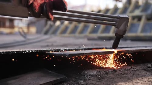 gas cutting of metal, sparks fly