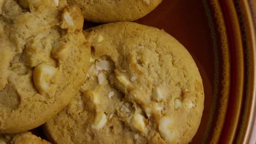 Golden Cookies with White Chips on a Plate