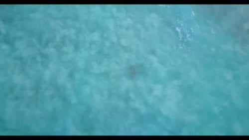 Aerial top down abstract of beautiful coast beach vacation by blue water and white sandy background