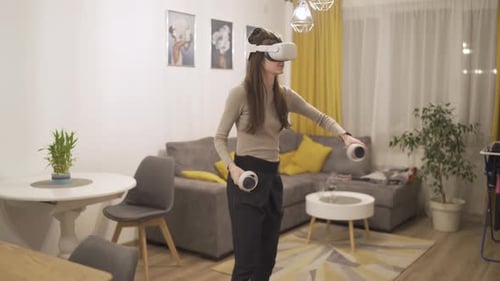 Woman Using Virtual Reality Headset at Home