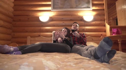 Couple Relaxing Together at Home Watching TV