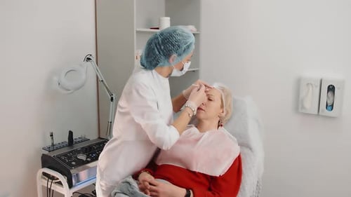 Woman Receiving Facial Treatment in a Medical Office