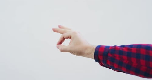 Hand Giving OK Sign on White Background