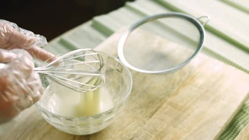 Mixing Food Ingredients with Whisk in Bowl