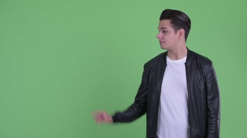 Young Adult Introducing Content on Green Screen