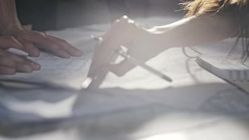 Architects Review Plans Together Indoors