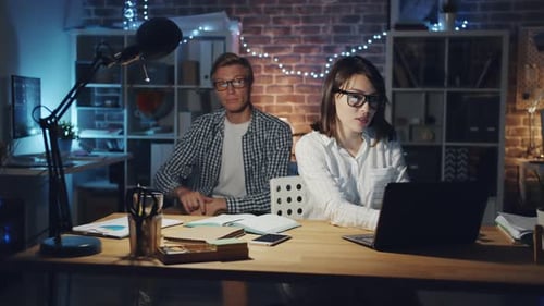 Portrait of Woman Asking Colleague for Help with Computer Talking in Office