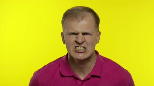 Angry Man Yelling Close Up on Yellow Background
