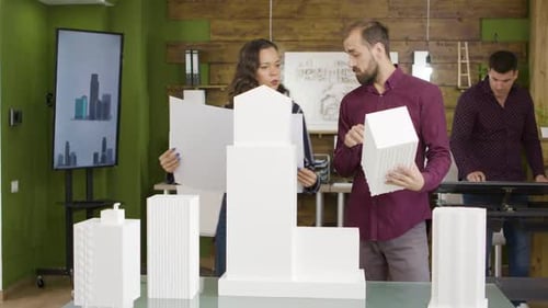 Team of Architects Checking Building Model for Business Park