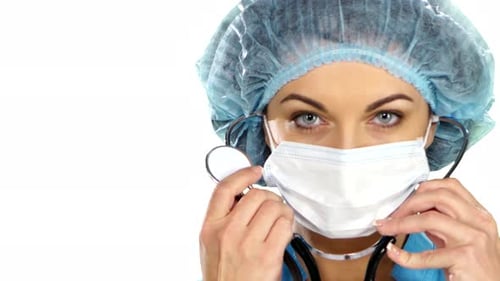 Surgeon in Mask Holds Stethoscope Close Up