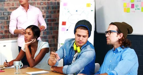Young Adults Attending Meeting in a Modern Office