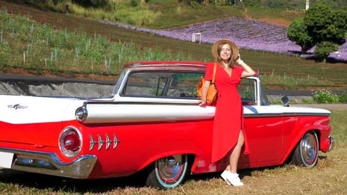 Woman Poses Next To A Stylish Vintage Car