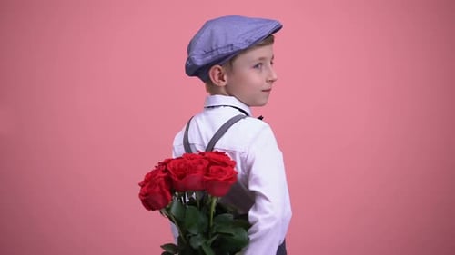 Boy Holding Red Roses Behind His Back