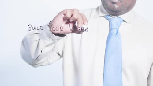 Asian Businessman Writes Build Your Website