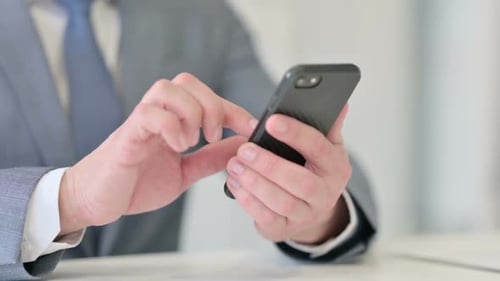 Close Up of Businessman Using Smartphone Mobile