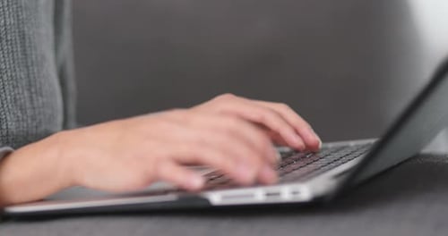 Working on laptop computer