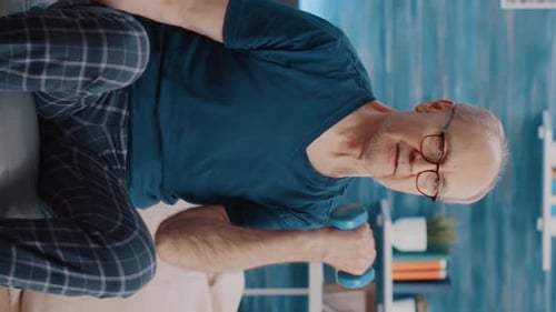 Man Working Out with Dumbbell at Home