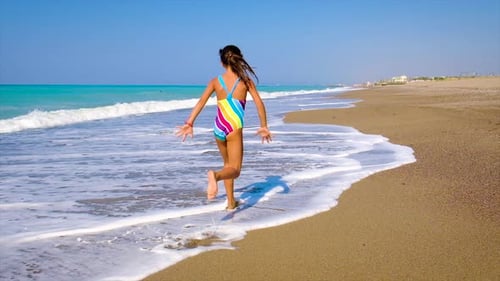 Child Running on the Beach