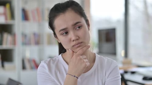 Young Woman Thinking and Pondering