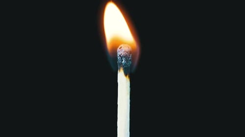 Match Being Lit and Burning in Macro