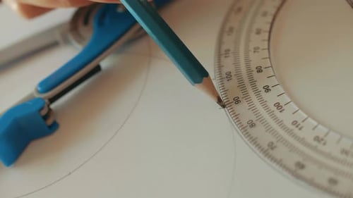 Hand Drawing with Protractor, Pencil and Compass