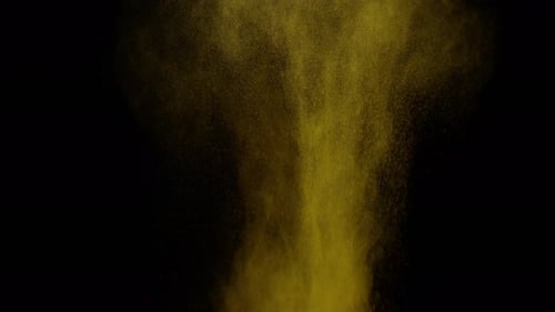 Closeup Shot of Yellow Seasoning Powder Thrown Vertically MidAir
