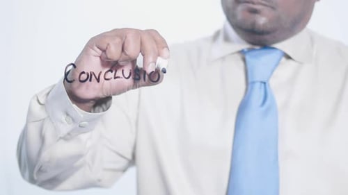 Writing the Word Conclusion on Glass in Bright Light