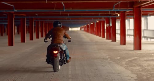 Biker Rides a Motorcycle in a Helmet