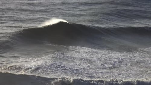Large Wave Rolling on Surface of Stormy Ocean