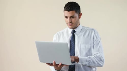 Young Man Working on Laptop