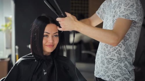 Woman Getting Hair Styled at Fashionable Hair Salon