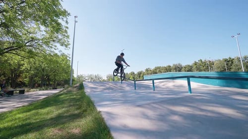 Man Sliding On The Railing In Park