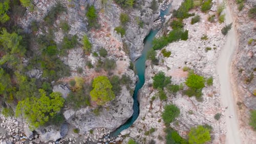 Flying Among Rocky Mountains in a Deep Prehistoric Gorge
