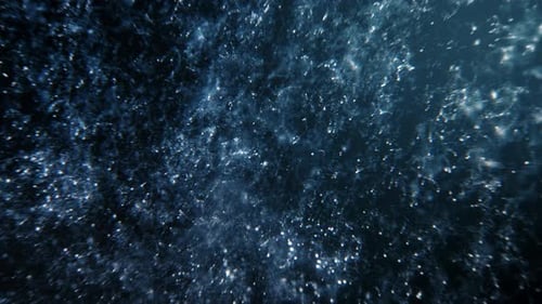 Festive blue silver macro particle loop of abstract shimmering bubbles